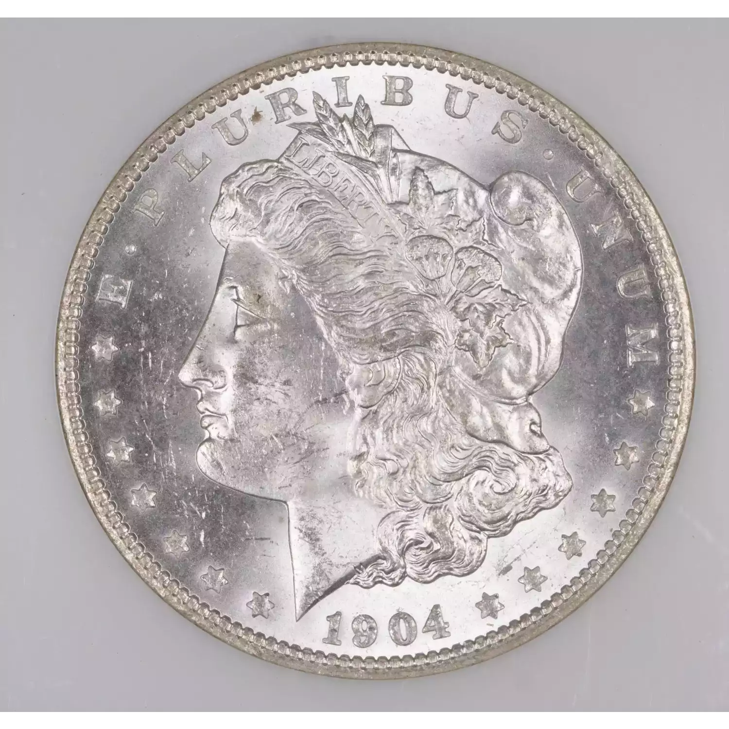 1904-O Morgan Silver Dollar NGC MS-64 - Hertel's Coins Inc.